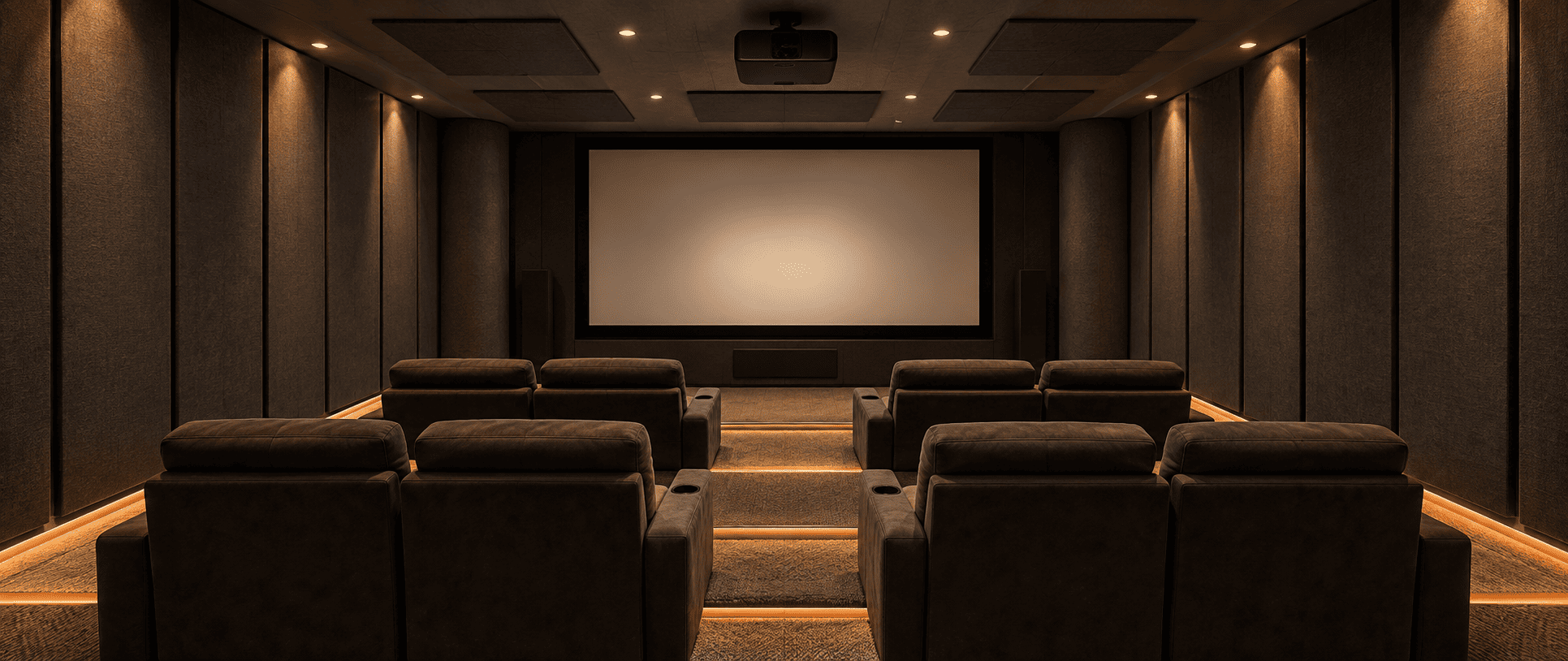 Dedicated home theatre room with tiered seating, dark acoustic wall panels and recessed lighting